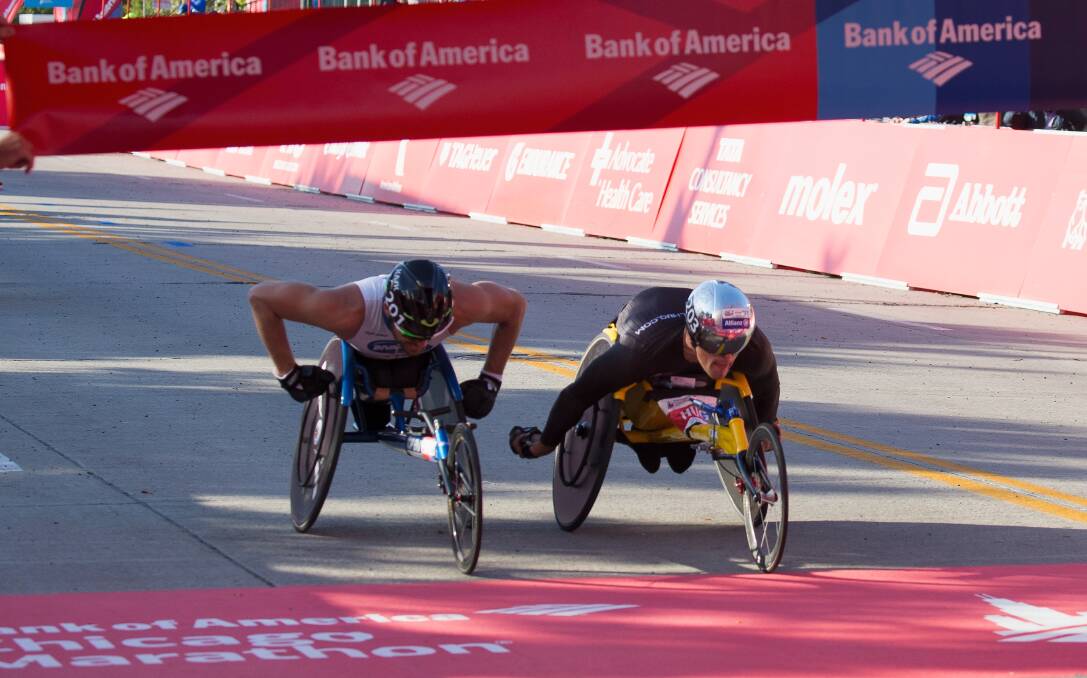 SO CLOSE: Kurt Fearnley (left) is narrowly defeated by Switzerland's Marcel Hug in Sunday's Chicago Marathon.