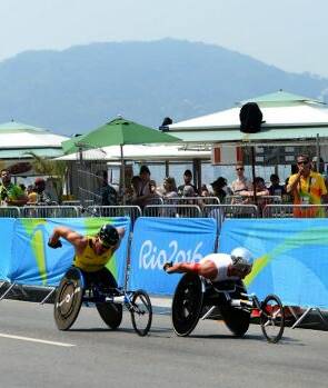 THEN THERE WERE TWO: Kurt Fearnley and Marcel Hug break away. Photo: SMH