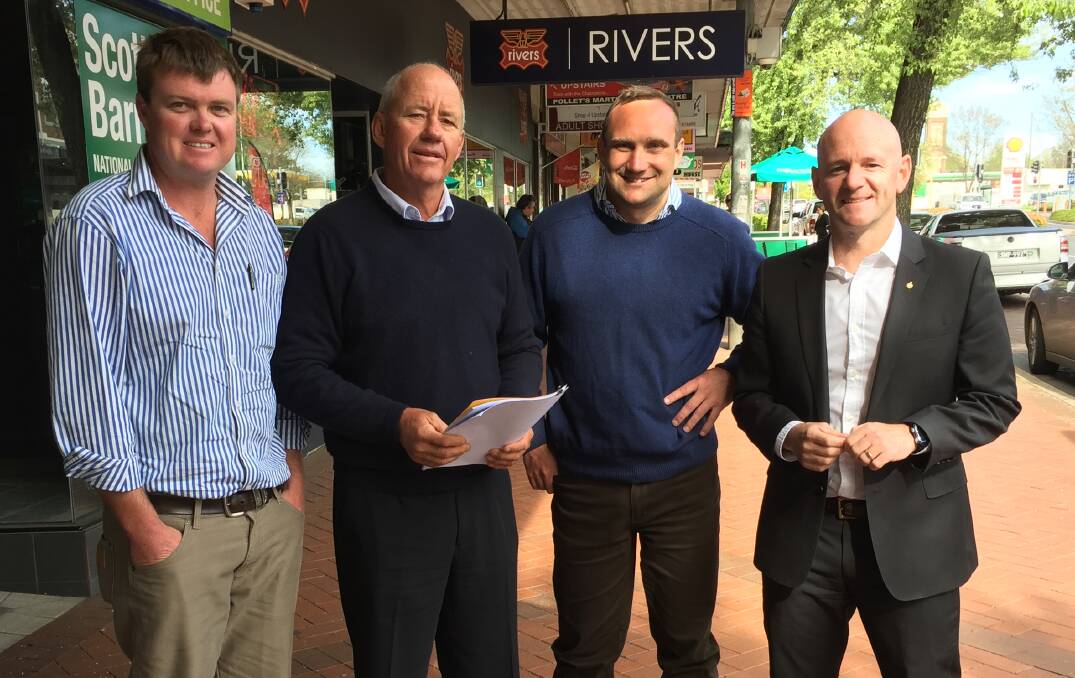 SIGN OF THE TIMES: Tom Green (Lachlan Valley Water) and Michael Payten (Belubula Landholders) with Nationals candidate Scott Barrett and Primary Industries, Lands and Water Minister Niall Blair. Photo: DAVID FITZSIMONS