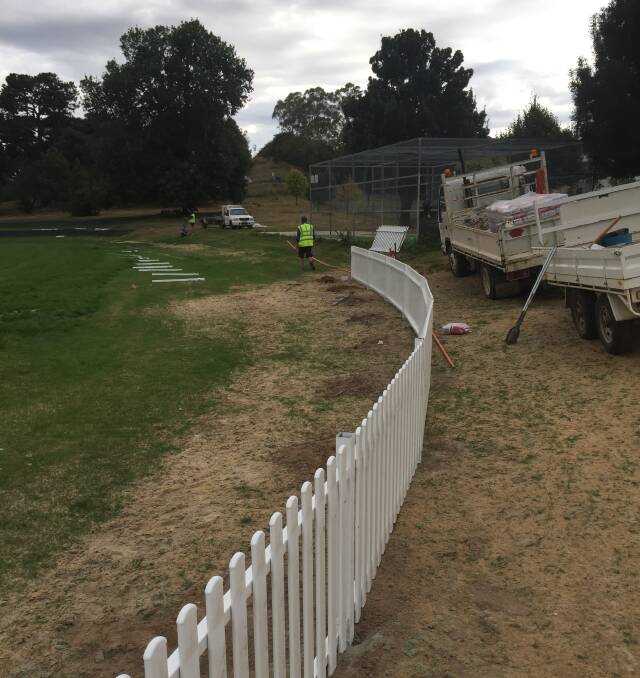 REVITALISED REDMOND OVAL: The new picket fence under construction at Redmond Oval.