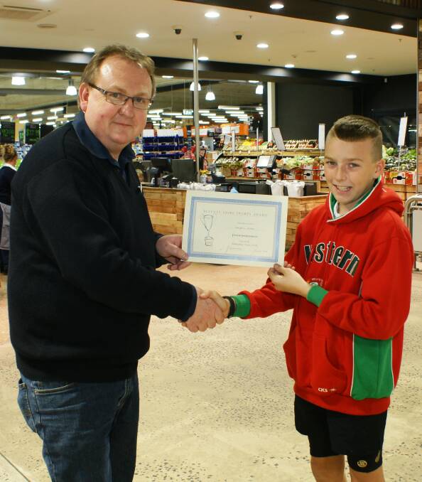 Kaydden Hoad was presented with his certificate for junior rugby league by Bernardi's marketplace manager Michael Ross. 