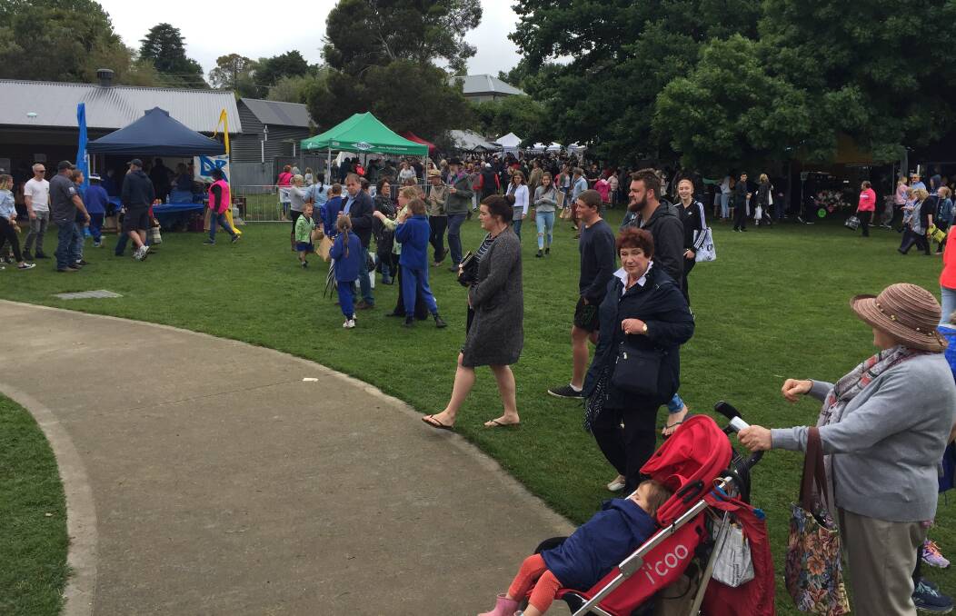 FLOODING IN: Shoppers heading into inspect the goods at Sunday's Millthorpe Markets. Photo: MARK LOGAN