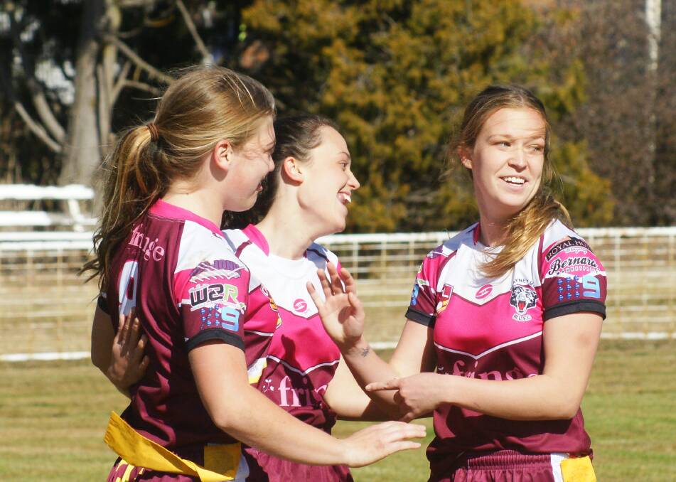 Sister Act: A perfectly timed pass between Sophie Stammers and Abby Stammers saw Abby (centre) cross the line to score the winning try against St Pats. Photo: Mark Logan