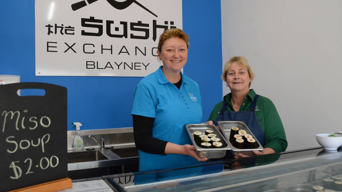 Good roll up: Kelly Morrissey and Annette Cock are welcoming customers to the Sushi Exchange on Adelaide Street. Photo: Mark Logan. 