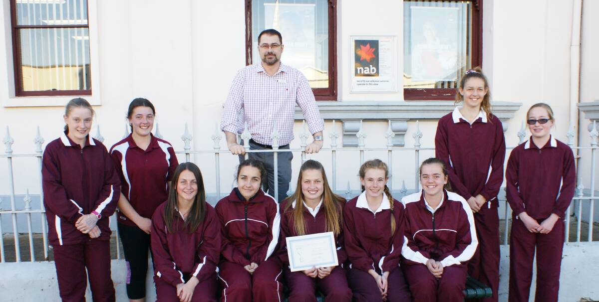 Blayney Girl's U14 netball team were the winners of best team in June and were presented their award by NAB Branch Manager, Amos Northey.