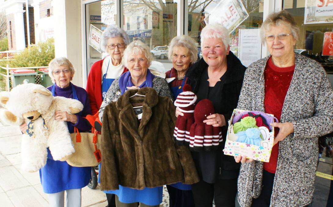 Bargain lovers: Margaret Bentley, Molly Taylor, Merle Sherlock and Enid Rich volunteer at Vinnies while  Terry Read and Heather Drady volunteer at the Anglican Op Shop. Photo: Mark Logan