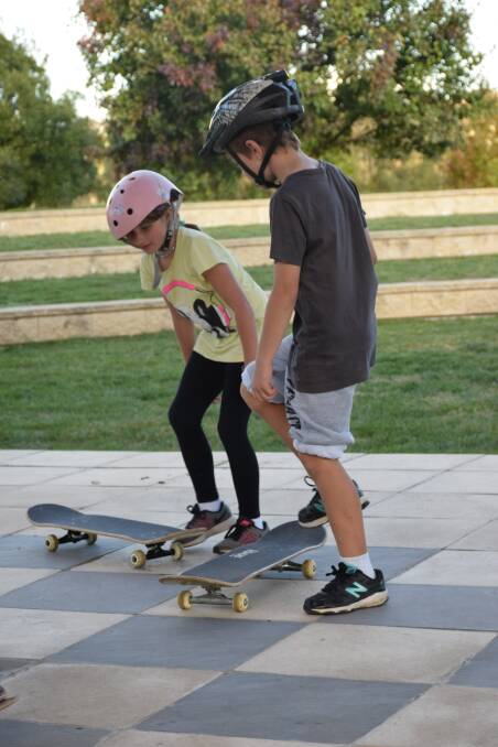 Balancing act: Lilly Ashfield and Jayden Dobson took part in a Skateboard workshop at Heritage Park in April. Photo: Margaret Paton