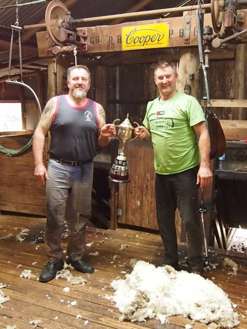 Winners: Shearers Bill Johnson and Kerry Johns (President of show society) with Australian Champion Fleece Trophy.