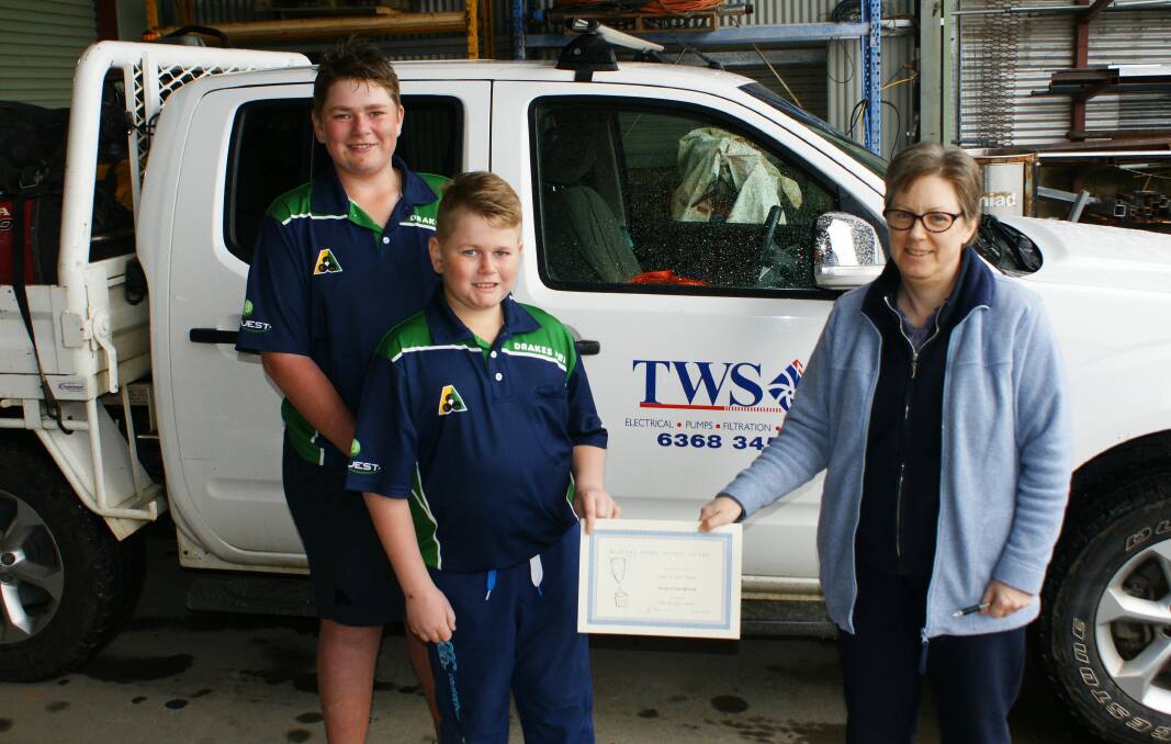 Zack and Joey Farr picked up the July teams award presented by Cathy Grenfell at Ted Wilson and Sons