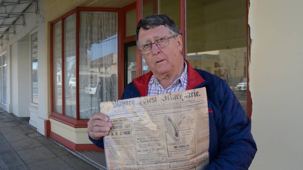 Big read: Les Fordham visited the Blayney Chronicle with a 1920 copy of the Blayney West Macquarie News. Photo: Mark Logan