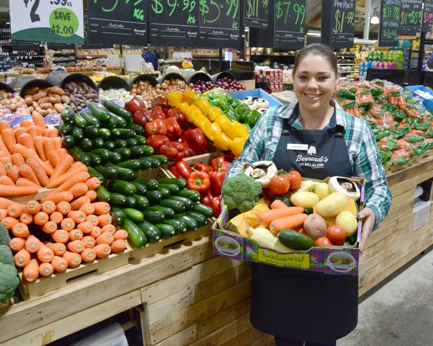 Top value: Bernardi's Celisha Roach with one of the produce boxes that will be available at discounted prices to those who join in the HHWC.