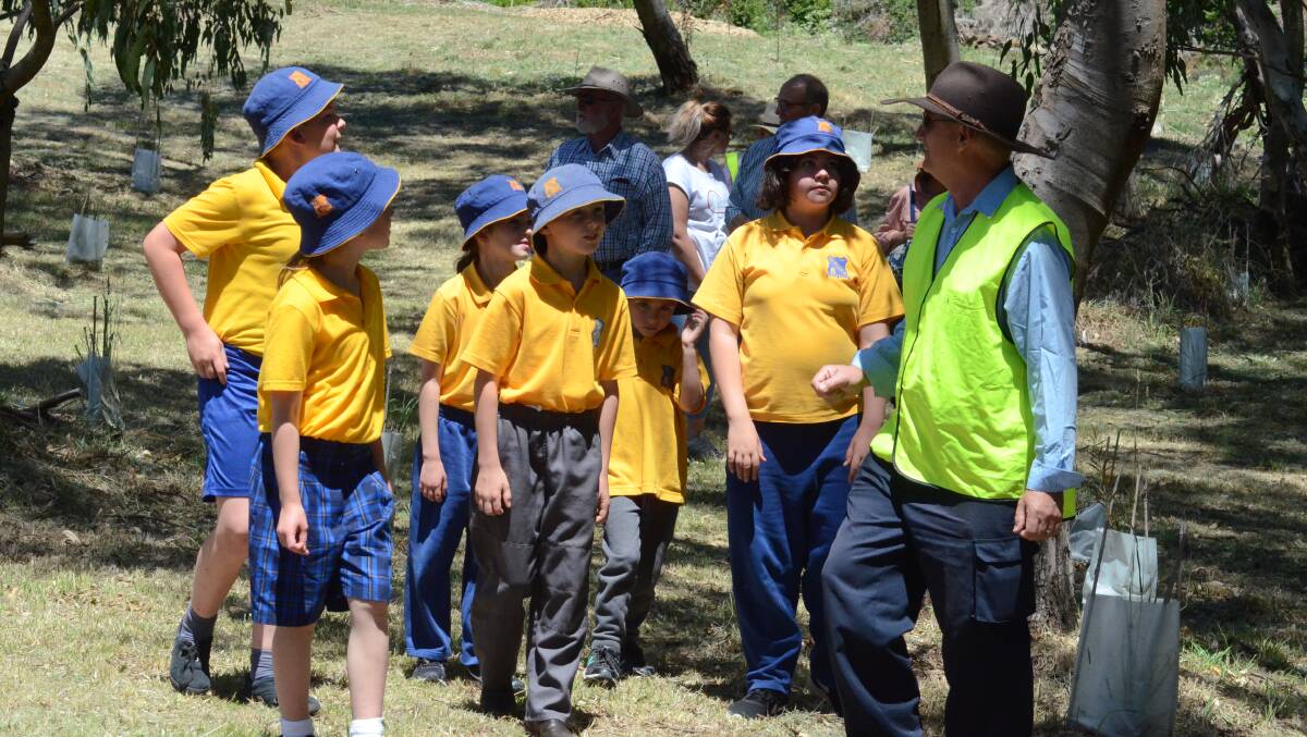 Taking it in: Brian Parker with students from Carcoar Public School checking out the revived Pound Flat area.