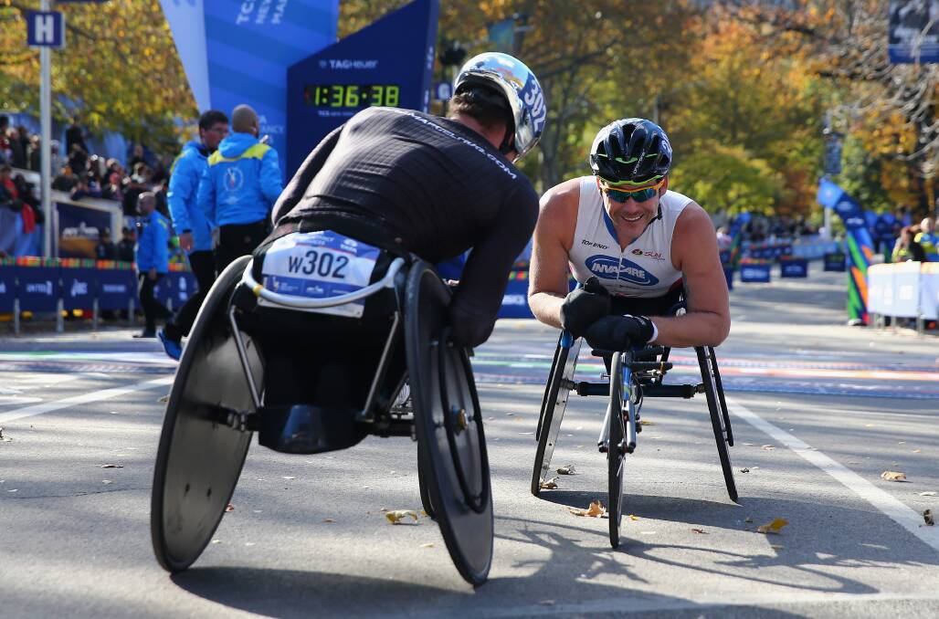 FRIENDS AND RIVALS: Marcel Hug (left) won the Boston Marathon in record time on Monday, while Kurt Fearnley (right) placed fourth. Photo: GETTY IMAGES