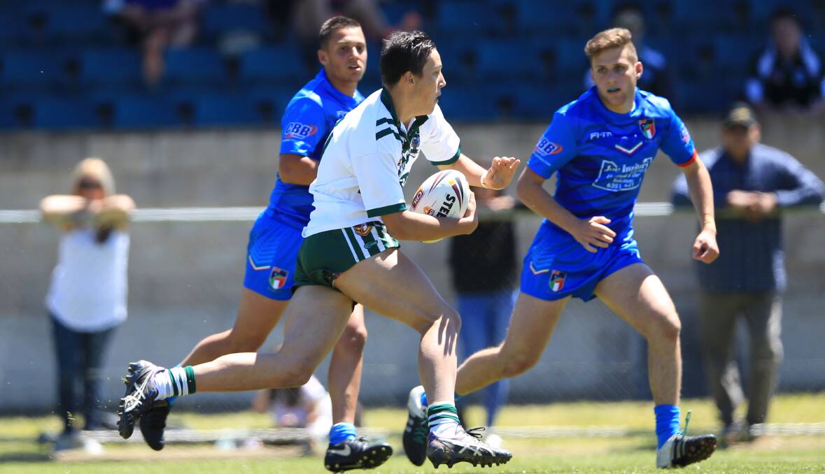RAM RAID: Blayney's Joey Hobby charges on to the ball during Western's clash with Federation of Italia Rugby League Australia at Carrington Park on Saturday. Photo: PHIL BLATCH
