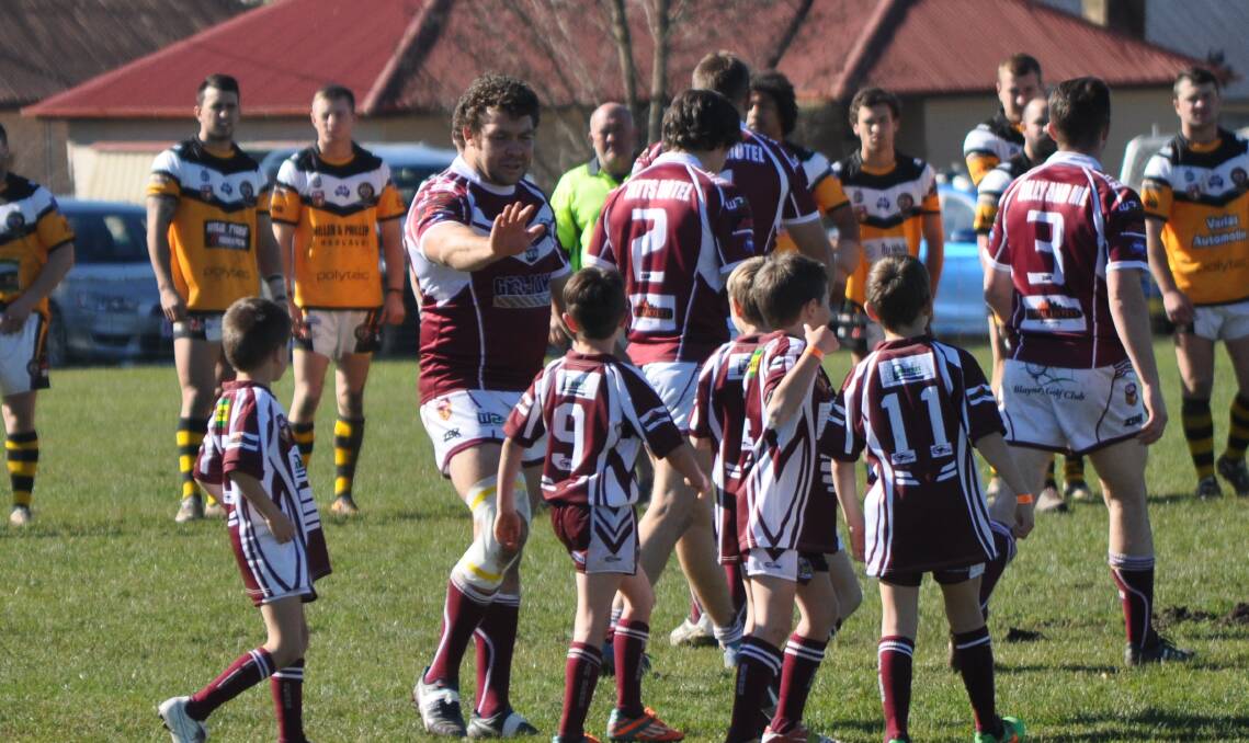 CLASS ACT: Bears new captain-coach Will Ingram interacts with the club's juniors during a home game in 2016. Photo: NICK McGRATH