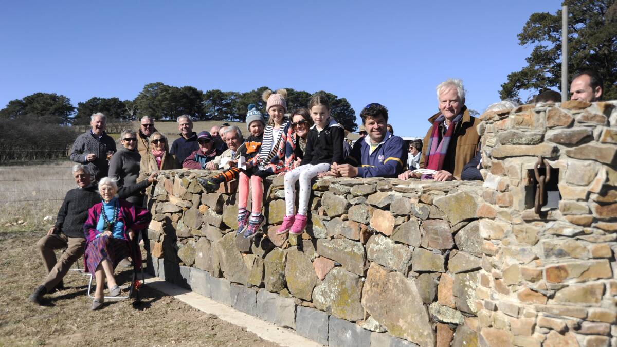 Some of the volunteers involved in building the new stone wall entrance way to Millthorpe.