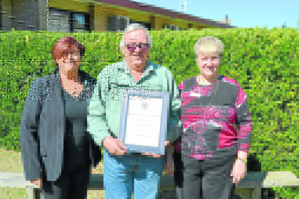 Rotary Club of Blayney president-elect Leeanne Wright, past president Miles Hedge and Blayney Health service manager Kathy Hillier. Mr Hedge is holding the Alf Gillespie community service award that was presented to the Rotary Club of Blayney in recognition of the community bus initiative.