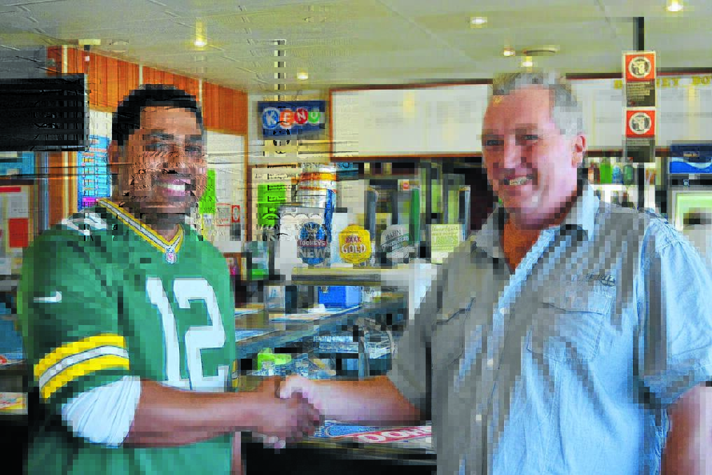 Blayney Sports Club's new chef Lui Chungson is congratulated on his position by club manager Rick Connolly.