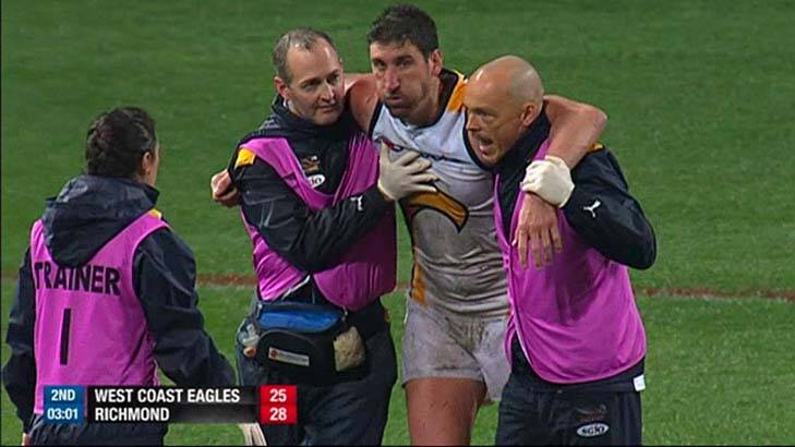 Not a good look: Dean Cox is taken off concussed after being hit. Photo: Channel Seven