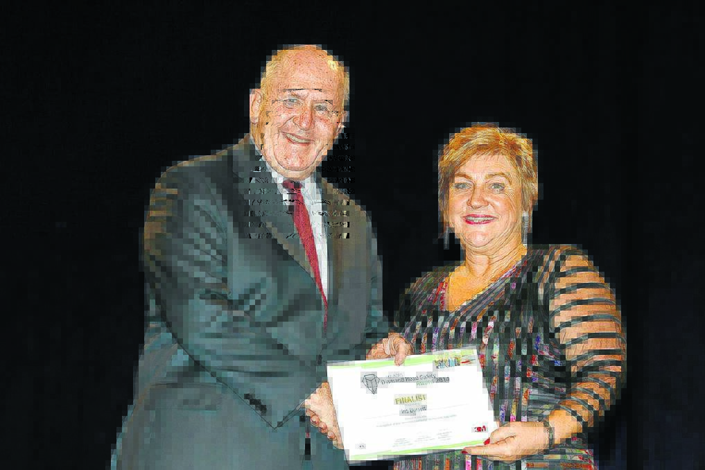 Tablelands Area Road Safety Officer Iris Dorsett receiving her Diamond Road Safety finalist award from Governor-General, His Excellency Sir Peter Cosgrove.