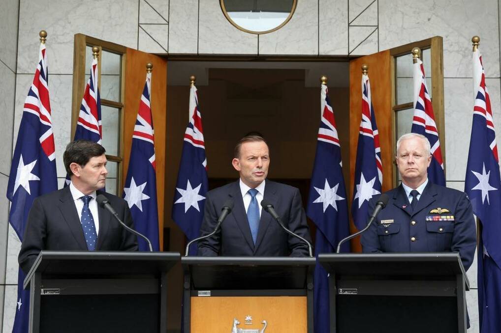 Defence Minister Kevin Andrews, Prime Minister Tony Abbott and Chief of the Defence Force Air Chief Marshal Mark Binskin on Tuesday. Photo: Alex Ellinghausen