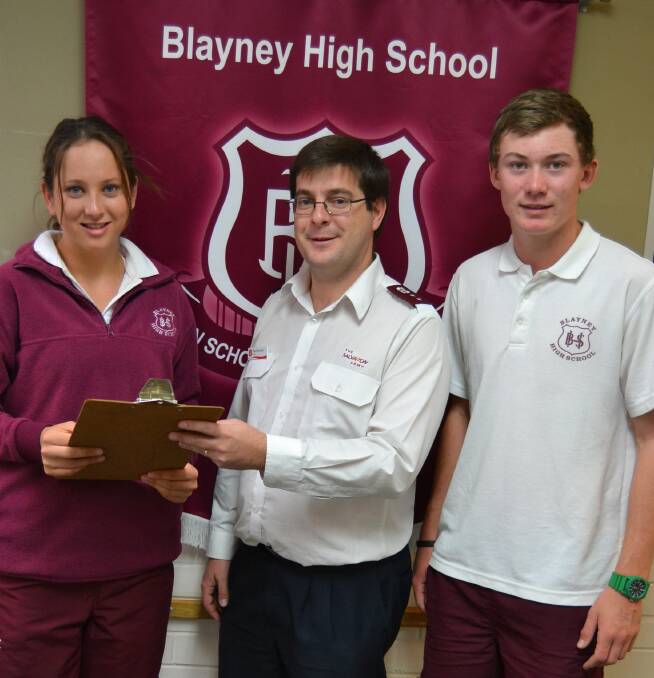 Blayney High students Georgia Calub and Jordan Little with Salvation Army officer Captain David Grounds.