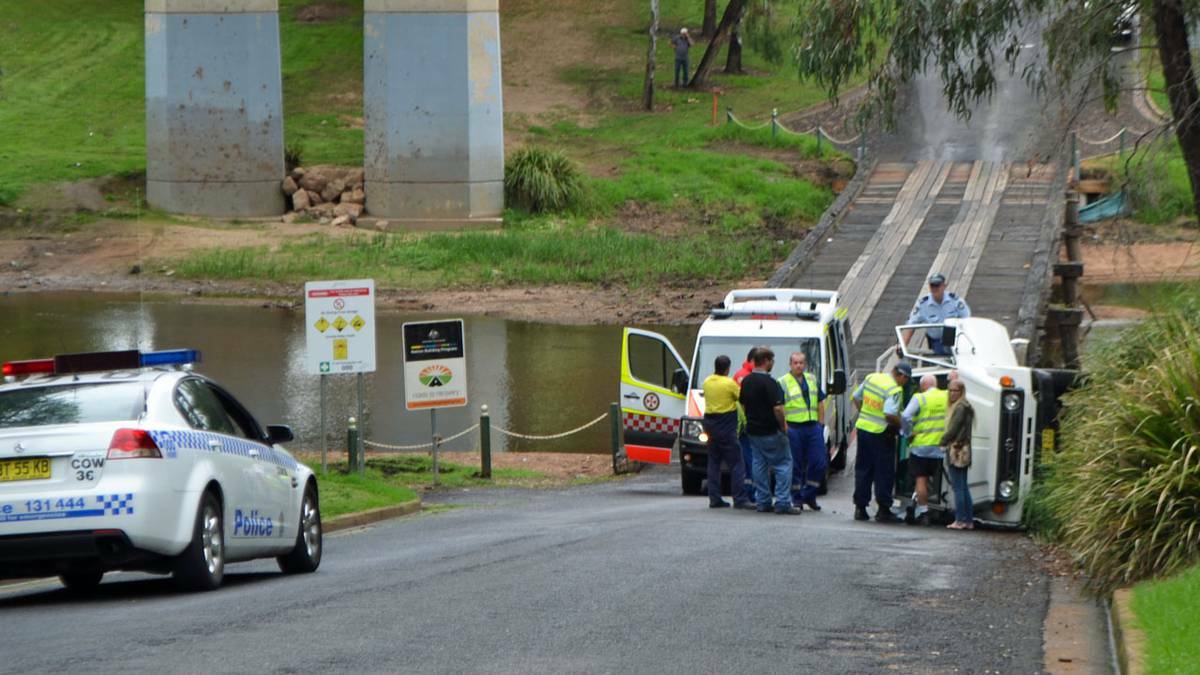 COWRA: A vehicle travelling in an easterly direction has overturned on the low-level bridge. The single-vehicle accident occurred at approximately 2pm on Friday, with emergency services working to free the female driver from the car. 