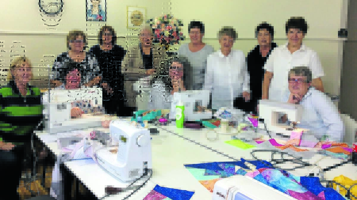 TRADITION: The Millthorpe So & Sews Lois Willing, Amanda Barfield, Gloria Dwyer, Francis Dalzell, Eleanor Fairbairn-Wilson, Gen Wilby, Kerry Adams, Dot Beasley, Lyn May, Lyris May and Helen Knox celebrate Mother’s Day with a spot of quilting. Photo: Jackie Irvine
