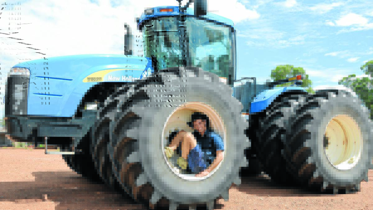 Today’s modern tractors make life a lot easier for today’s modern farmer. Hayden Westcott emphasised the size of the tractor with this fun shot. Photo: Bill Jayet 