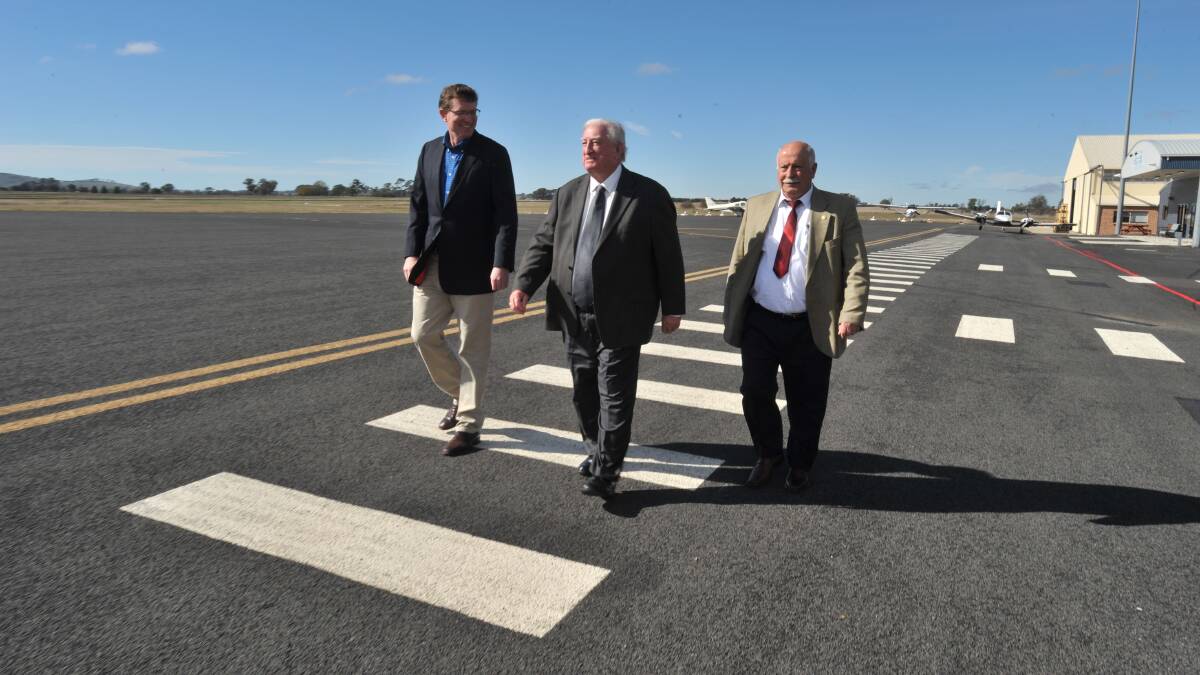 CLEAR SKIES AHEAD: Member for Orange Andrew Gee, mayor John Davis and Cr Chris Gryllis announce an upgrade to Orange Regional Airport’s runway thanks to the NSW government’s Regional Tourism Infrastructure Fund. Photo: JUDE KEOGH 				              0525jkairport1.