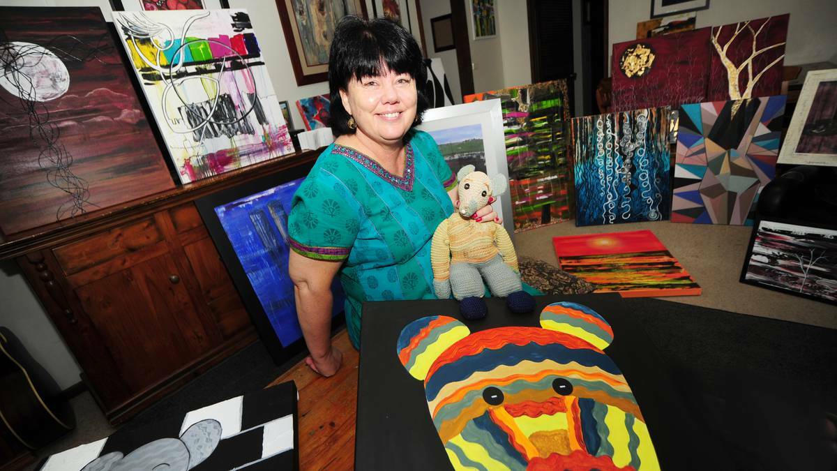 DUBBO: Artist Laurie Rouse held her childhood toy Ratty, the subject of one of her works in the exhibition Moments Then & Now