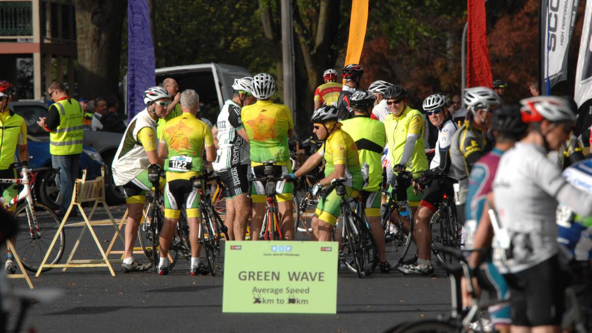 FOLLOW THE SIGN: A team of riders collect themselves beore the start of SUnday's race. Photo: ZENIO LAPKA