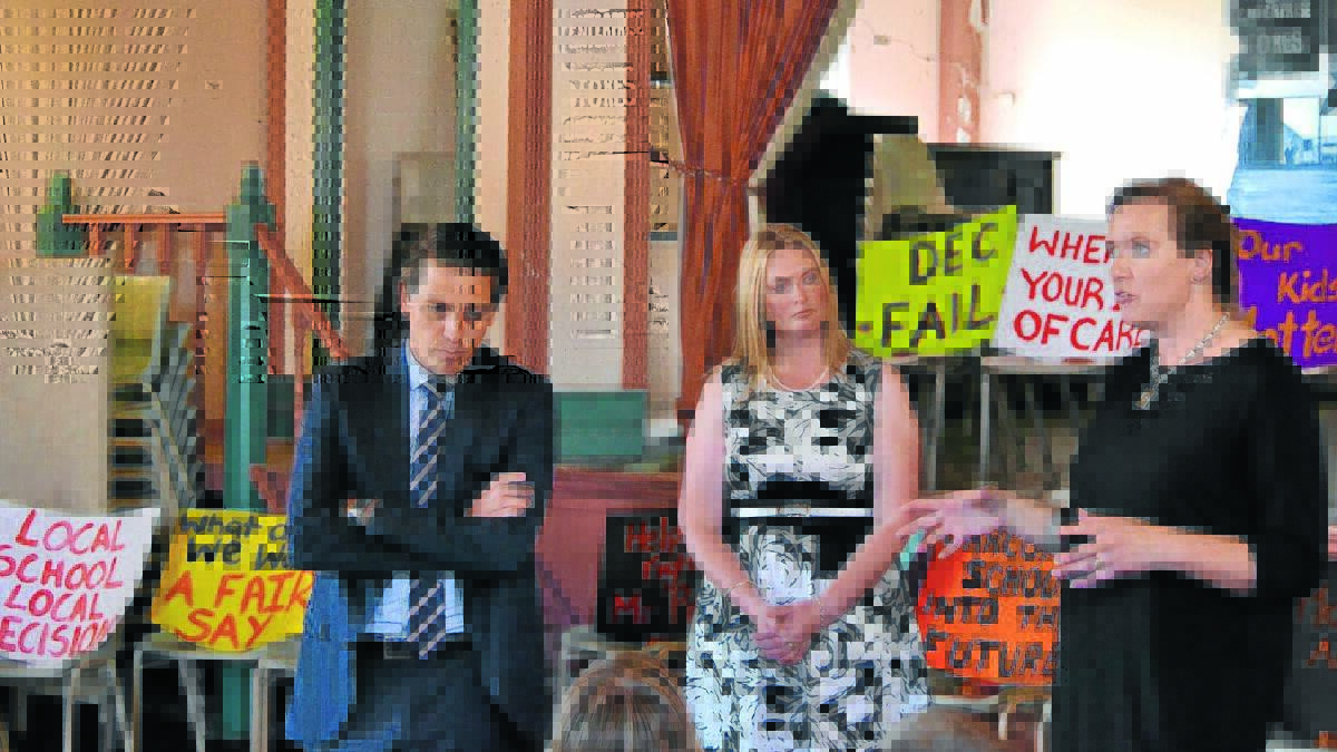 TOUGH LESSON: Carcoar School P&C president Nicky Parker (right) addressing residents at a meeting at the Carcoar School of Arts Hall yesterday with opposition education spokesperson Ryan Park and Labor candidate for Bathurst Cassandra Coleman. Photo: BRYANT HEVESI
