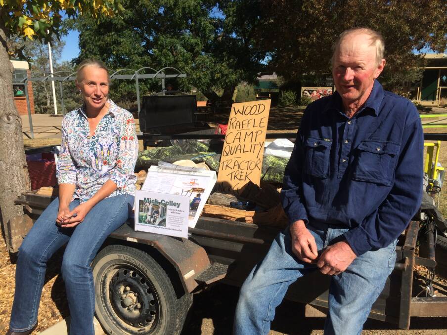 ON A RIDE: Penny and Mick Colley will draw the wood raffle winner at the O'Connell Public School polling booth this afternoon. The fundraiser is for the Camp Quality Tractor Trek. Photo: ALICE COOMANS.