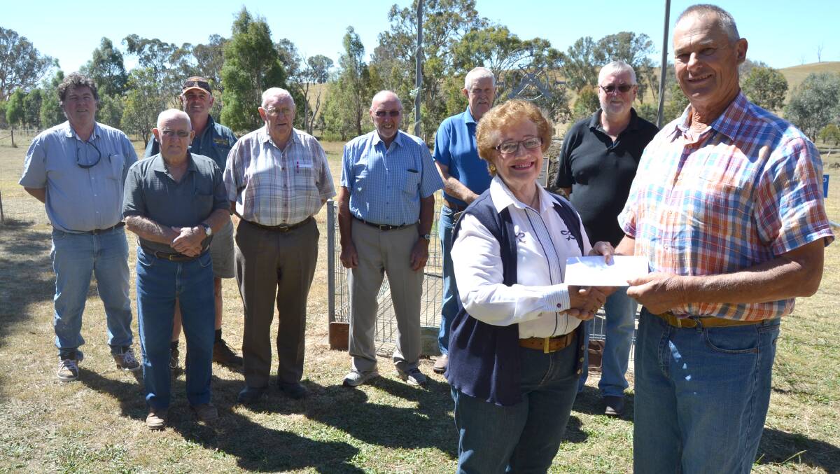 Uralba Retirement Village chair Audrey Hardman is pictured accepting the donation from the Club's captain Bruce Rowland, flanked by Club members and some of the Uralba board members.