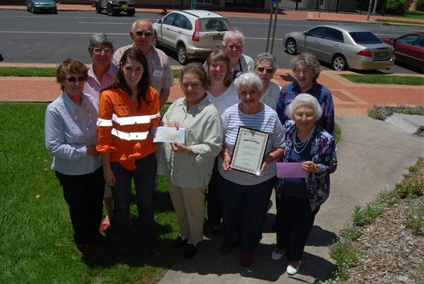 Newcrest Mining community relations officer, Alison Hamilton, presenting a cheque to Kathy Roach, president of the Blayney branch of the Diabetes Council of Australia pictured with volunteers from The Cottage.