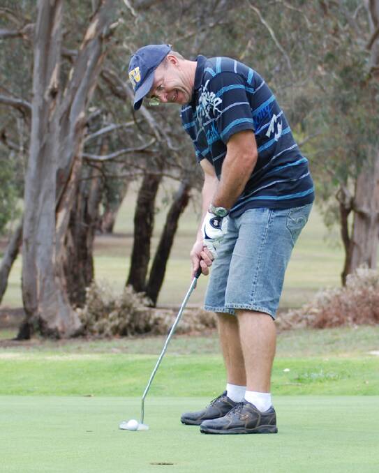 John Connolly attempts a putt during the Patrick Memorial golf day on the weekend.  Photo: Wayne Cock.