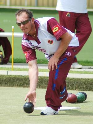 NICE BOWL: Brett Davey puts one down during the fours championships on Saturday.