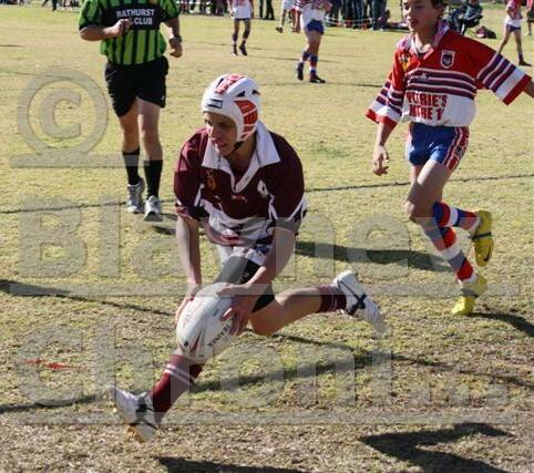 GOLDEN TOUCH: Hayden Williams puts down a try for the Blayney under 14’s junior league side in their match against Mudgee.  Photo: RANDI WALLACE