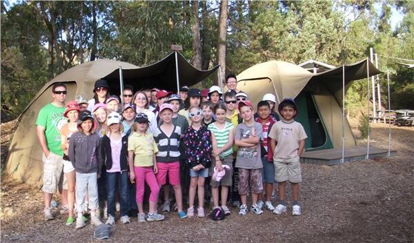 Years 3 and 4 students out the front of their tents at Western Plains Zoo in Dubbo.