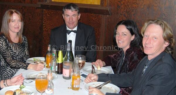 FINE DINING: Kim Healey, Dave Farr, Kristen Barnett and Gavin Howarth enjoy their meal at the gala ball. Photo:  WAYNE COCK