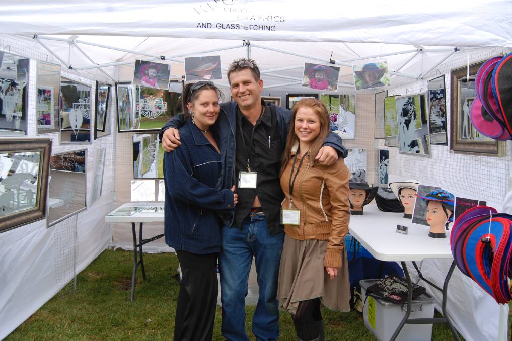 Kathy Ovsienko, Carl Smith and Ashley Denmead made up the talented team of KNC Glass Etching pictured at their stall at the Blayney Festival. Photo: Wayne Cock.