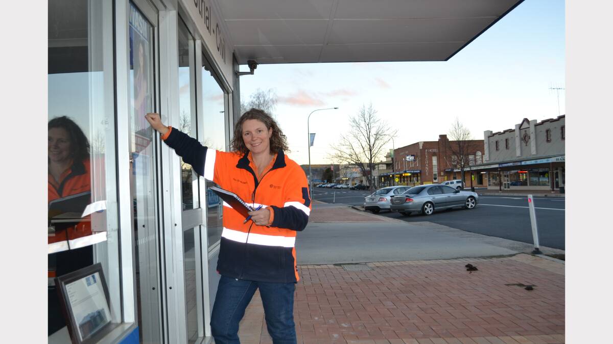Paula Dell-McCumstie, community relations officer with Cadia Valley Operations, in action door knocking along Adelaide Street to drum up support for the upcoming Blayney Festival.