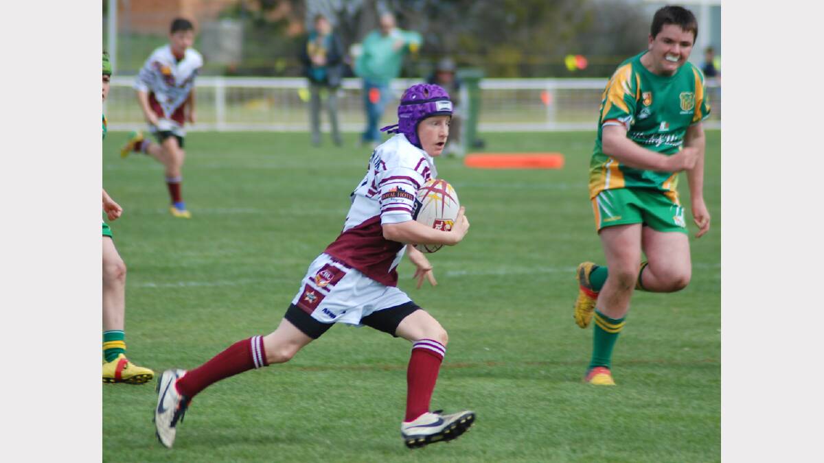  In the clear. Aaron Wells leads the CYMS defence a merry chase during the under 13’s win in Saturday’s minor semi-final.  Photo: Wayne Cock.