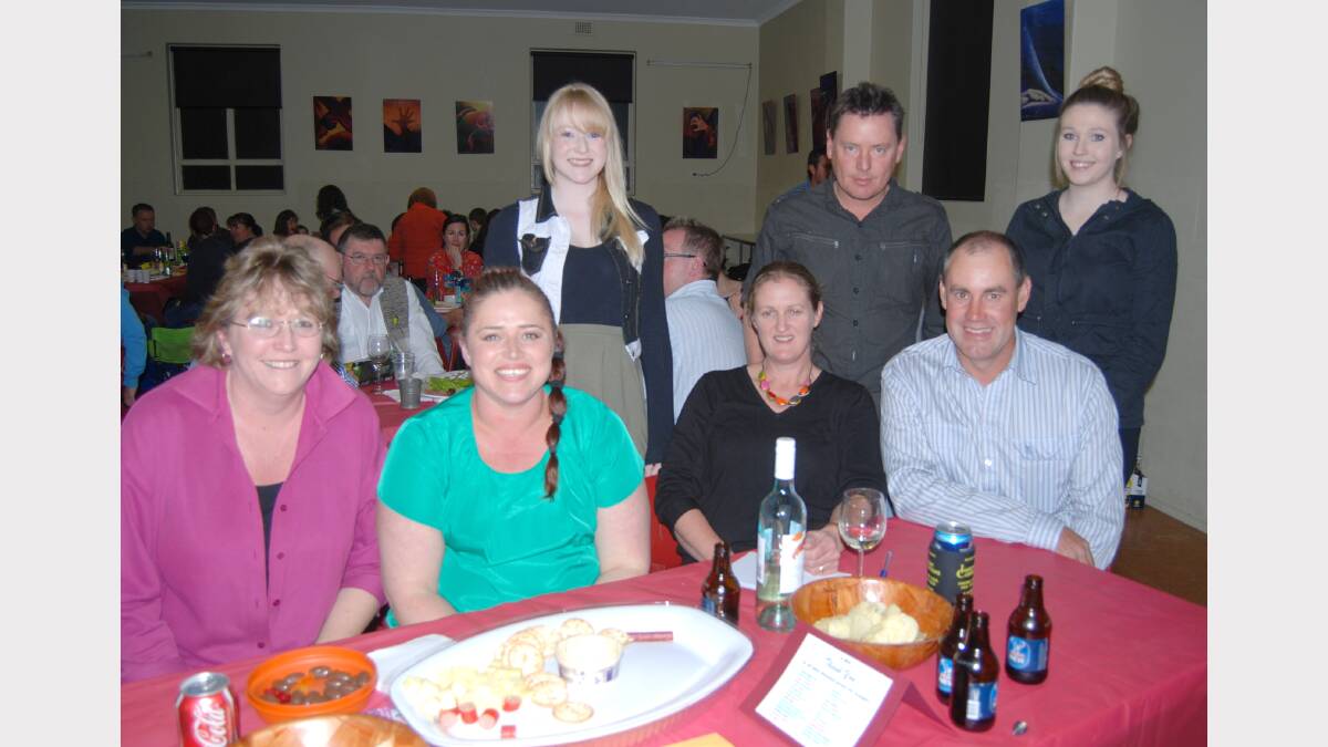 Alise McIntosh, Justin Press and Laura McIntosh (standing) with Louise McIntosh, Susan Press, Tracey and Steve Cheney test the ol’ grey matter at the quiz night.  Photo: Wayne Cock.