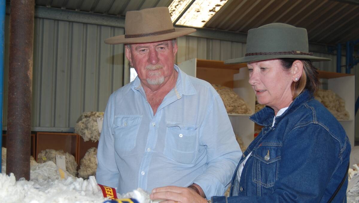 Trevor and Karen Maher look over some of the winning fleeces at the Trunkey Horse and Wool Festival. 
