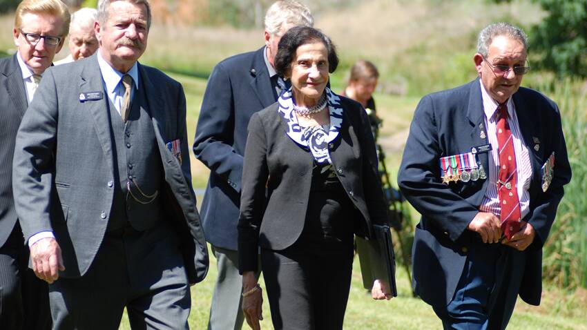 Geoff Braddon and Bill Macdougall of the Lyndhurst sub branch of the R.S.L. escort Governor Marie Bashir to the opening ceremony of the Memorial Garden in Carcoar.  Photo: Wayne Cock.
