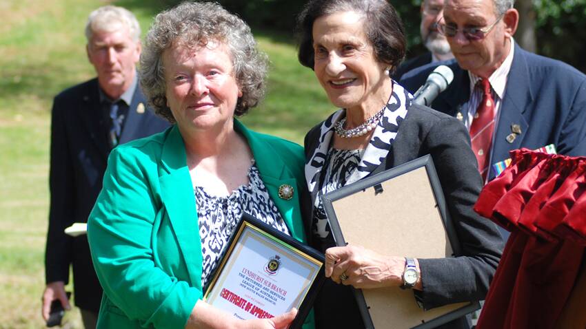 Linda Williams was rewarded for her tireless efforts in the Carmanhurst Museum by being presented with a certificate of thanks by Professor Marie Bashir.  Photo: Wayne Cock.