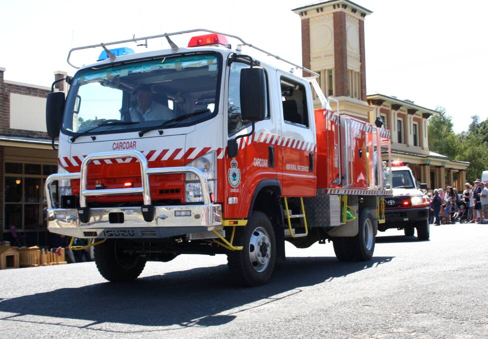 Anthony Bright driving the fire truck in the parade at Carcoar on Sunday.