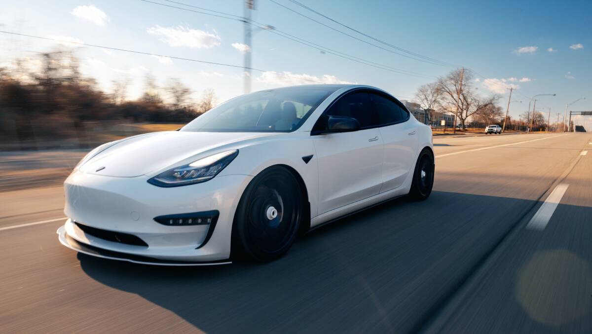 The teens allegedly stole two white Teslas, like the one pictured. Picture via Pexels